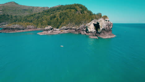 Aerial-point-of-view-in-Cape-Hillsborough,-Mountain,-Blue-water,-Boat,-Peaceful,-Holidays-Location