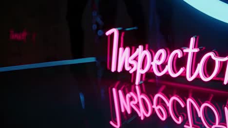 pink neon sign - inspector