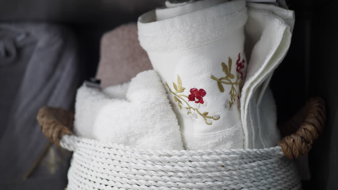 White Towels in a Wicker Basket