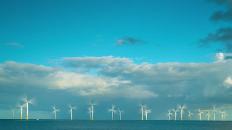 a timelapse of an offshore windfarm with a rainbow