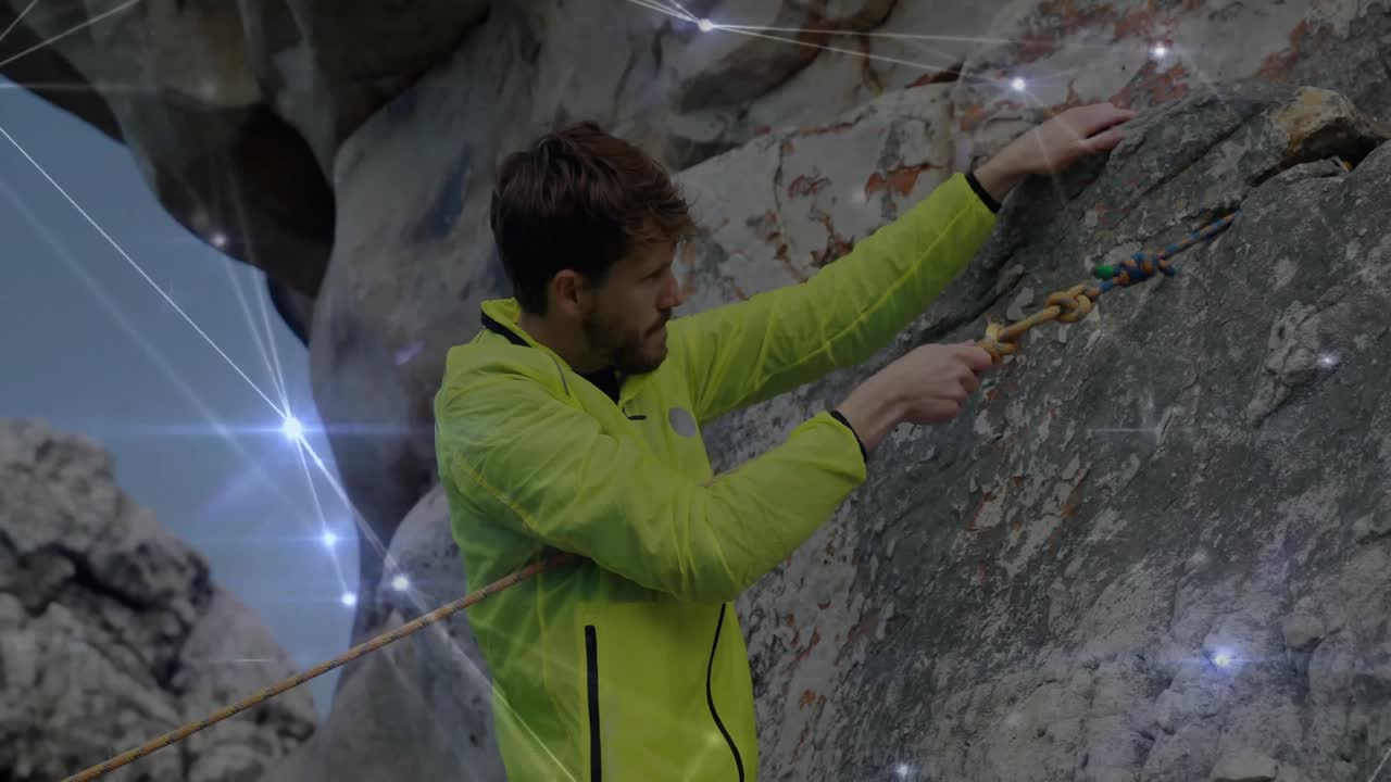 Male rock climber scaling sheer cliff, featuring technology-driven digital light points graphics