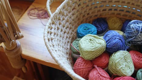 Bunches-of-different-coloured-woollen-yarn-kept-in-basket-4k-