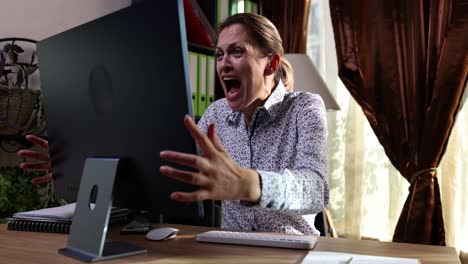 frustrated woman reacting angrily to computer problem