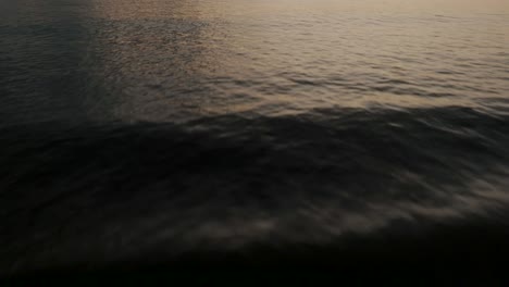 flight over tranquil beach in guanacaste, costa rica at sunset - drone shot