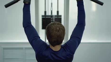 man performs an exercise to restore the back muscles