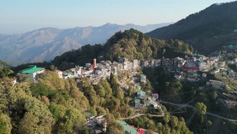 colorful buldings on hills in mussoorie drone moving left to right 180d view in india