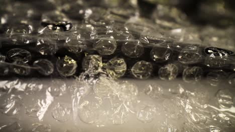 pushing-into-a-bubble-wrap-bag,-short-travel,-bag-bounces-around