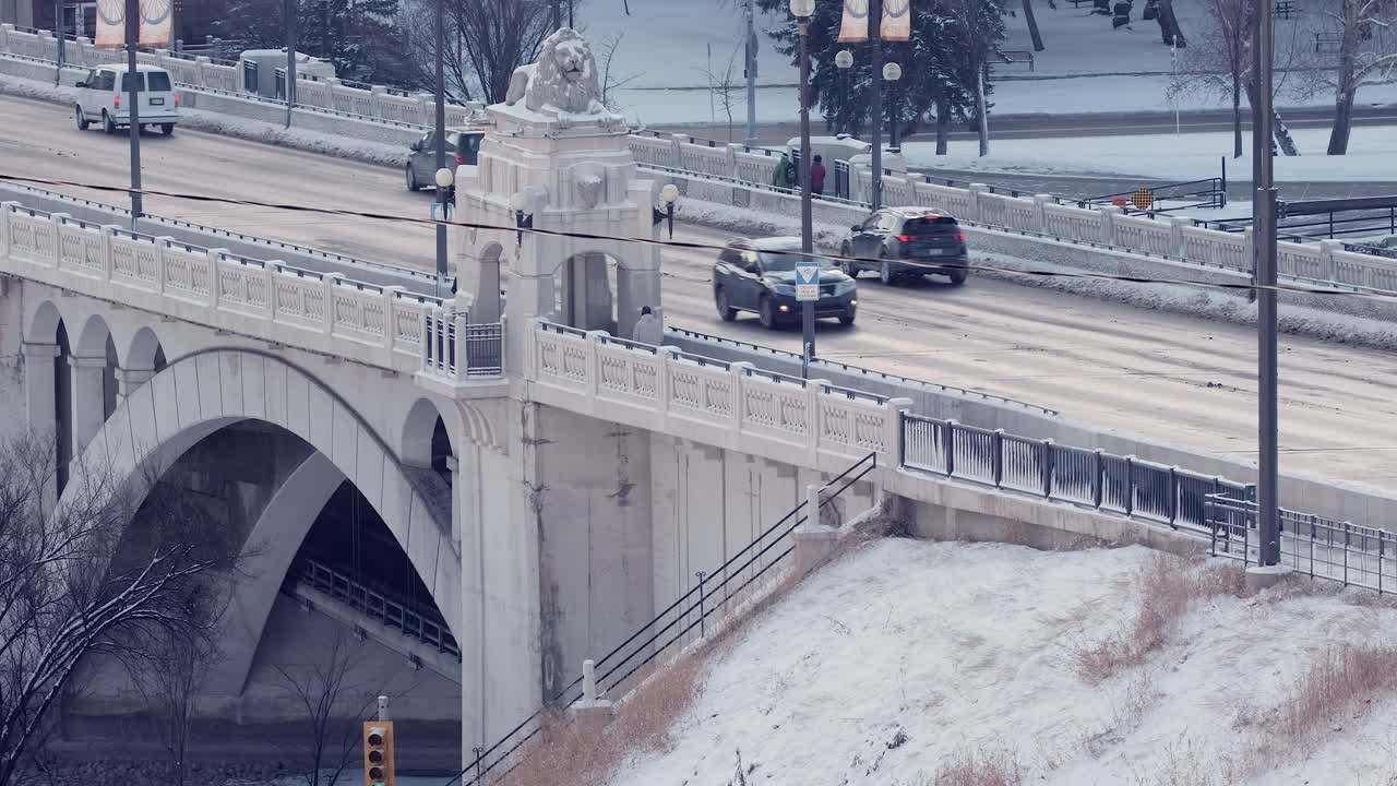 Vehicle and pedestrian traffic on cold Centre Street Bridge, Calgary