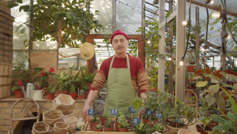 portrait of senior male worker at flower nursery