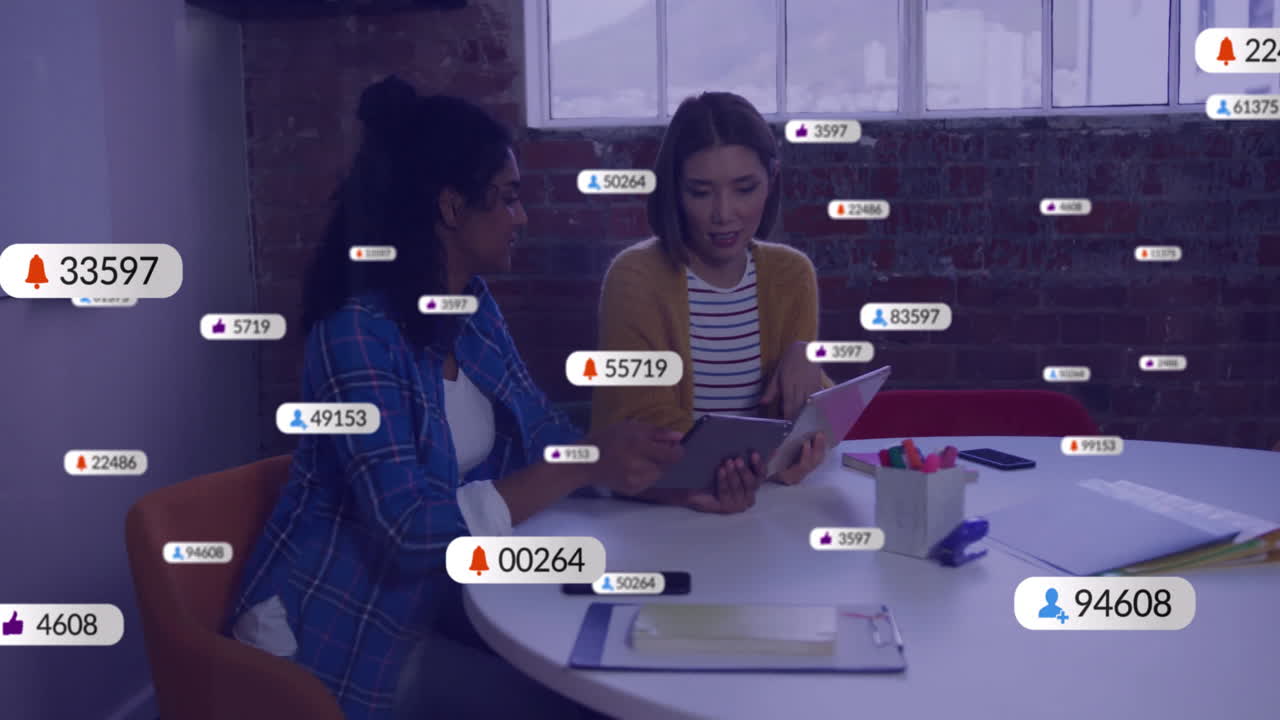 Animation of social media icons with numbers over diverse colleagues discussing work in office