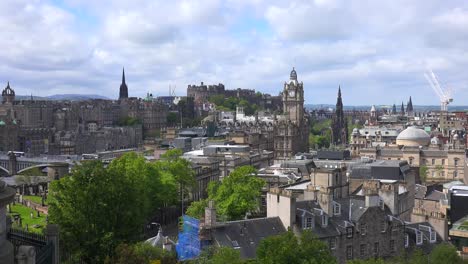 an establishing shot of clouds over the edinburgh scotland skyline