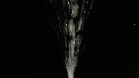 Water-spraying-on-black-background