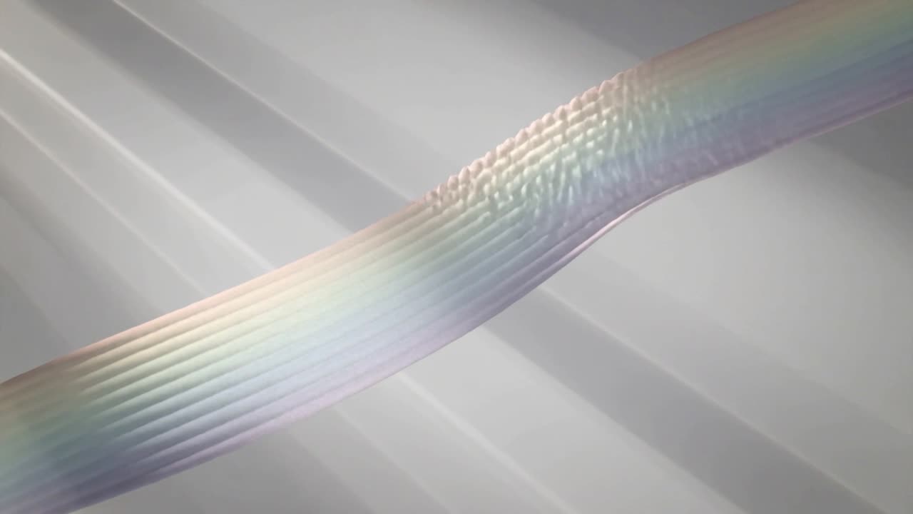 Playing iridescent ribbon moving diagonally in studio, revealing ribbed texture to show detail