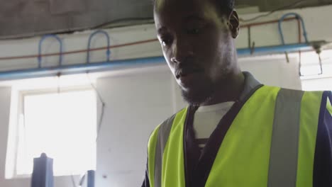 close up view of worker using tablet computer in factory