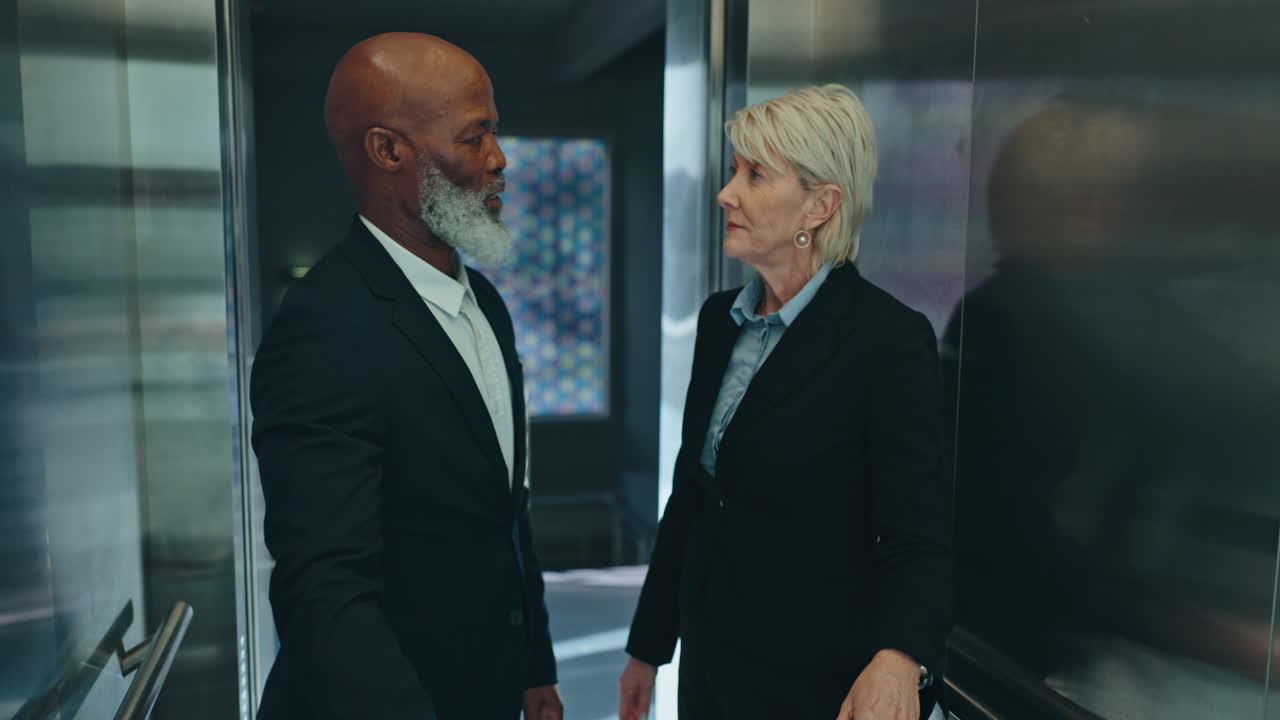Enter elevator, suitcase and business people