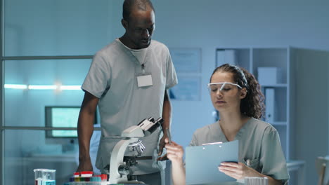 Multiethnic-Man-and-Woman-Working-Together-in-Lab