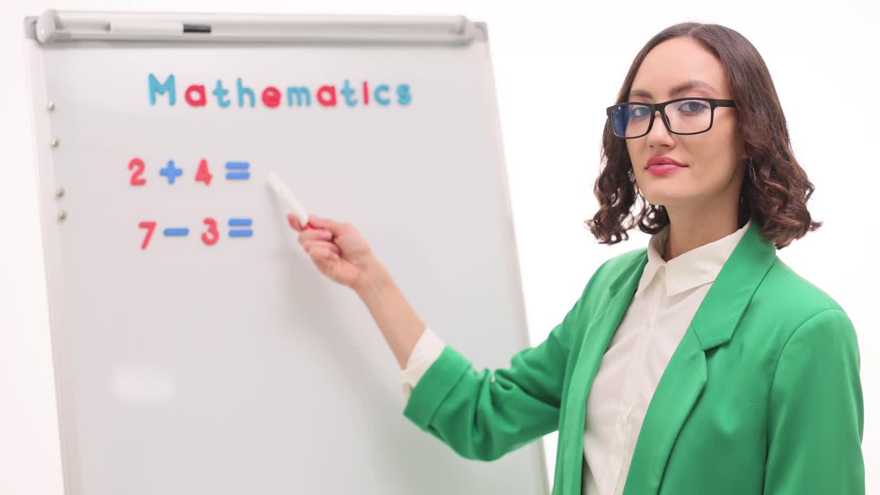 Woman Teaching Mathematics on Whiteboard
