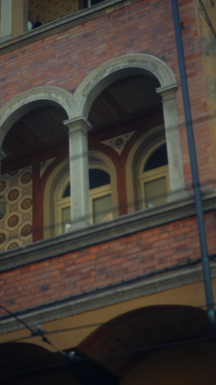 Ornate Brick Building Facade with Arched Windows
