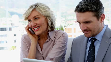business people working together on laptop