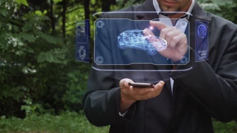 businessman uses hologram with modern suv