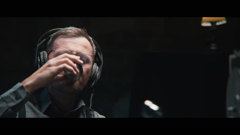 an intelligence officer listens to the wiretap recordings