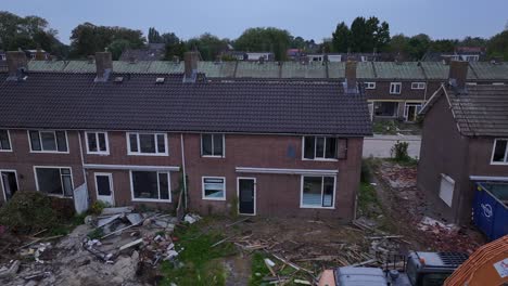 machinery on terraced housing estate to demolish buildings