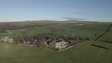 old english stone farm house with sheep pasture and solar panels