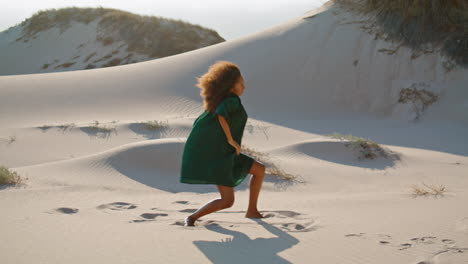 Emotional-woman-dance-desert-at-summer.-African-american-girl-performing-on-sand