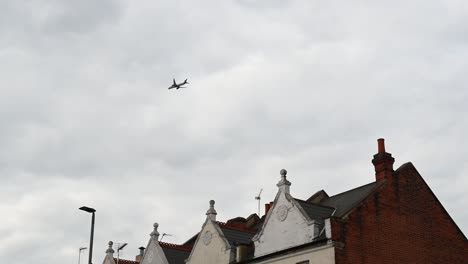 plane returning to heathrow over central london, united kingdom