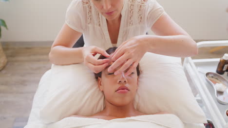 professional acupuncturist treating patient