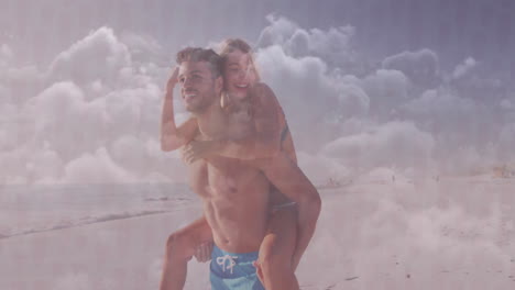 couple giving piggyback ride on beach for travel marketing, featuring ocean waves and cloud overlay