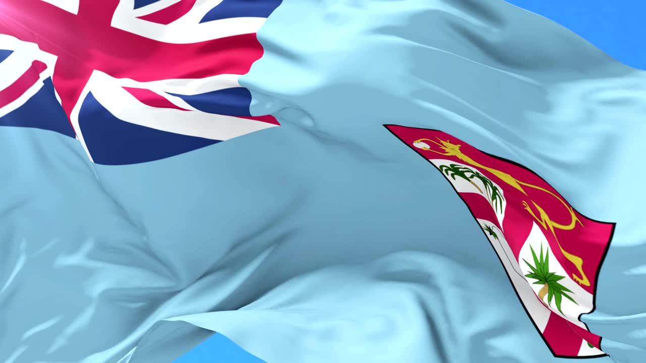 bandera de fiyi agitando el viento con el cielo azul en lento, bucle