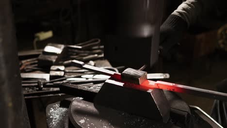 blacksmith working with red-hot metal