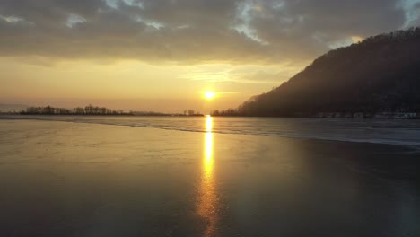 winter sunset over a frozen lake