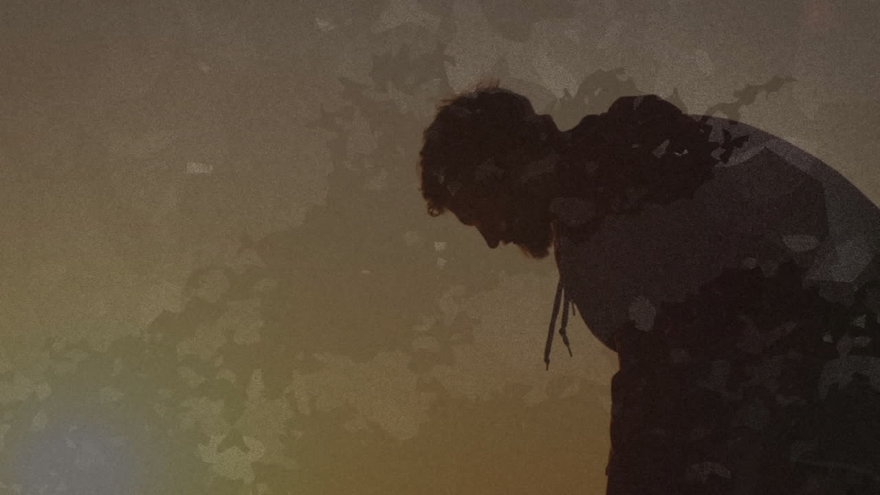 Person bending over abstract geometric pattern with animation in background