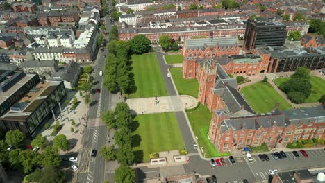 side-on and advancing aerial video of queen's university belfast, in northern ireland, uk on a bright and sunny day. produced at 4k resolution, 60fps and with rec709 color.