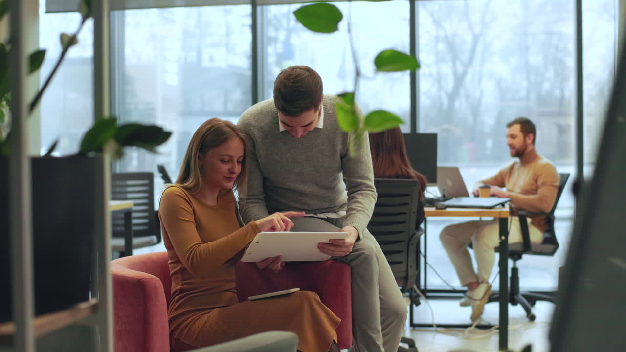 Coworkers talking in the office