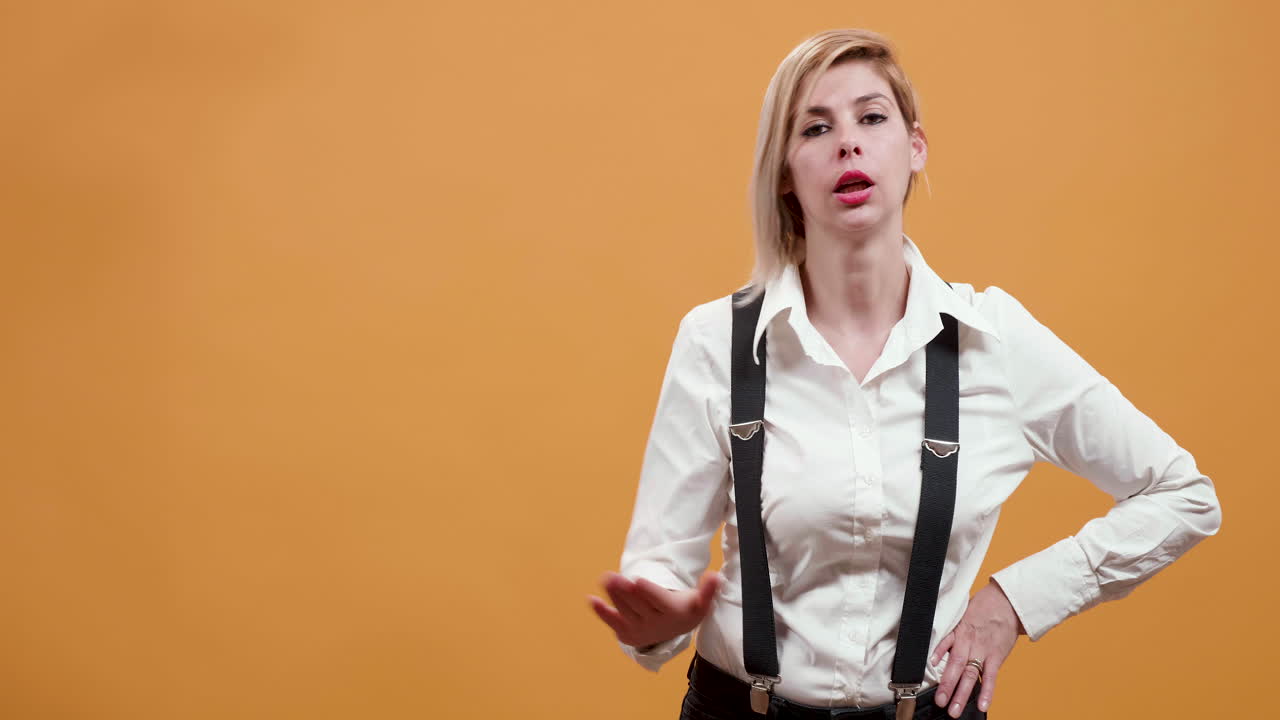 Woman in suspenders and white shirt