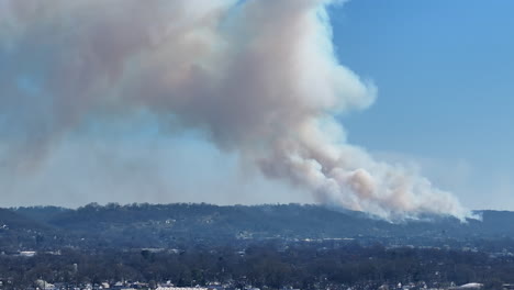 Telephoto footage of the smoke of a forest fire that is happening on a ridge in northern Georgia.