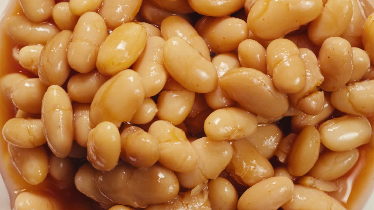 Canned red bans preserved beans rotating background close up side view. Organic steamed beans. Pickled bean for a Mexican dish
