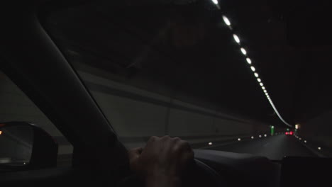 driving through a tunnel at night