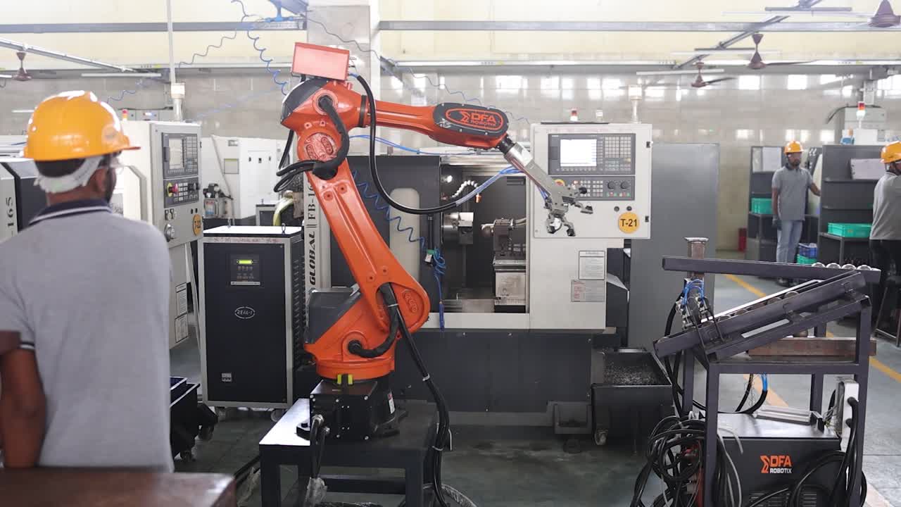 robotic arm raw material put the material a CNC machine. Industry 5.0, industrial 4.0 concept
