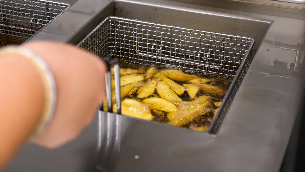 Frying french fries in a deep fryer