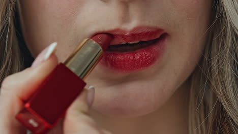 Applying Red Lipstick Close-Up