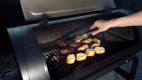 chicken wings and hanging tender meat on the grill