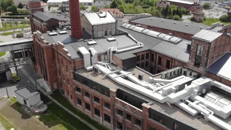 aerial tilt-up shot of the cukrownia znin, poland