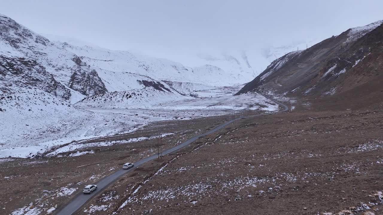 Snowy Mountain Road in a Valley