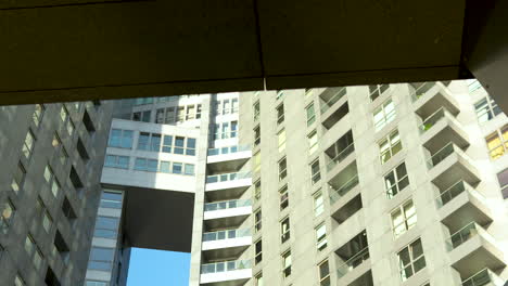 Modern-building-with-metal,-glass,-and-beige-cladding-in-daylight