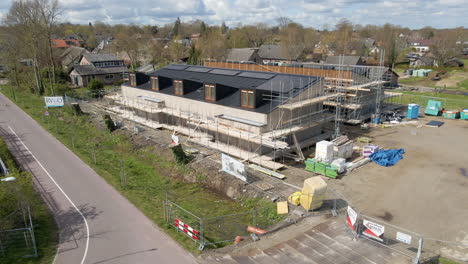 Wide-jib-up-of-new-houses-under-construction-with-solar-panels-on-rooftop