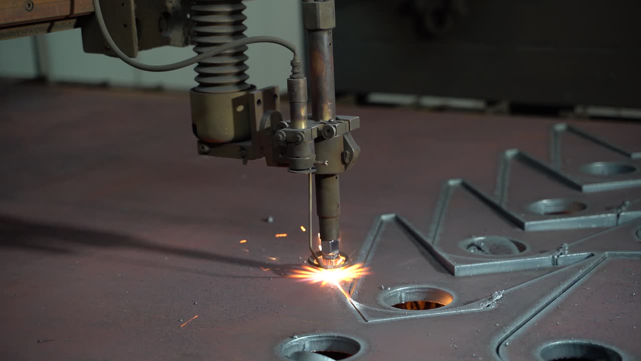 Plasma cutting of metal on an automatic laser machine. Laser plasma cutting machine for cutting parts from metal. Production Industry.